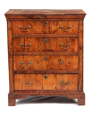 Lot 663 - AN EARLY 17TH CENTURY FIGURED WALNUT COUNTRY...