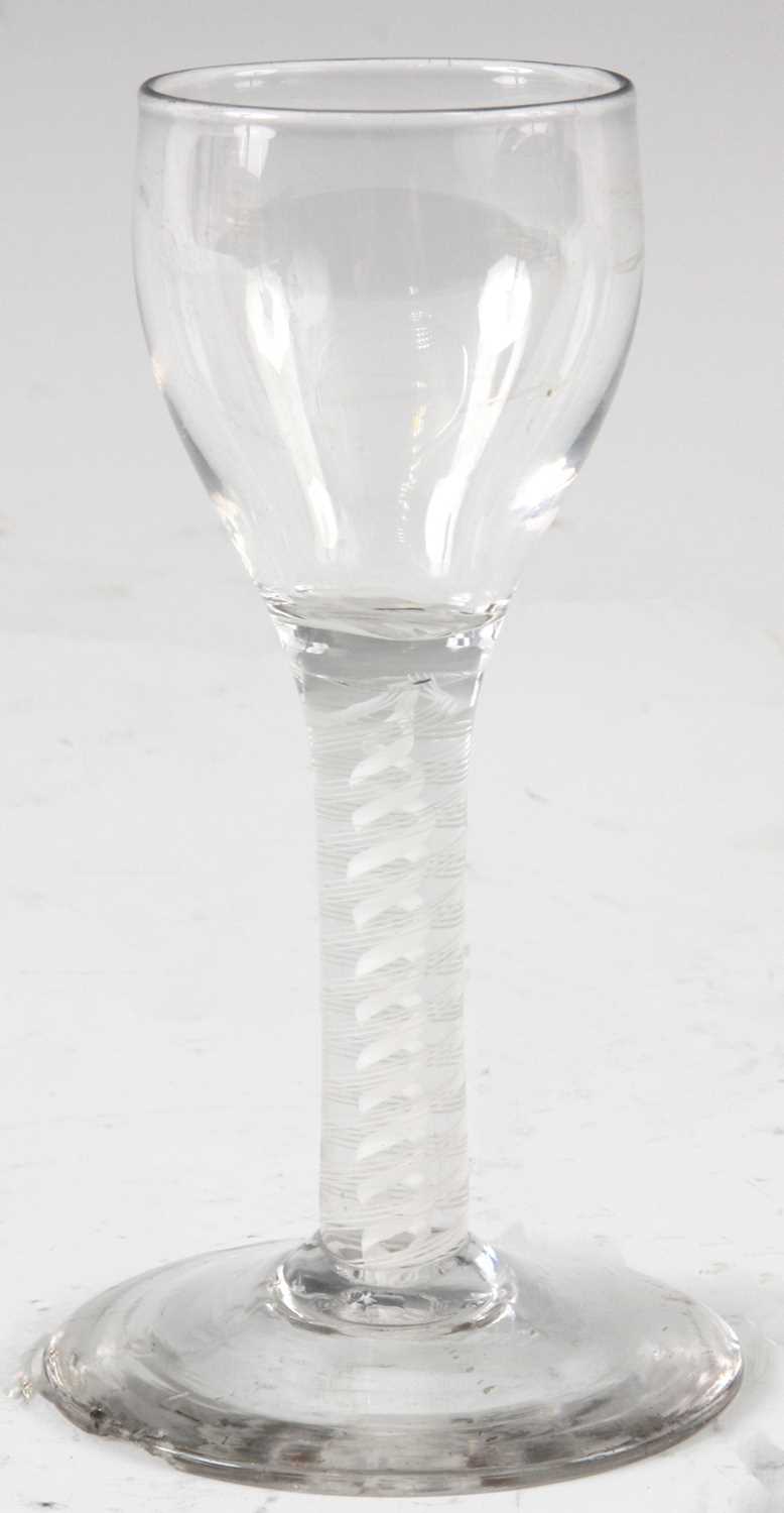 Lot 12 - AN 18TH CENTURY WINE GLASS with ogee bowl and...