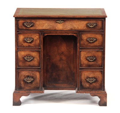 Lot 780 - A 19TH CENTURY WALNUT KNEEHOLE DESK with...