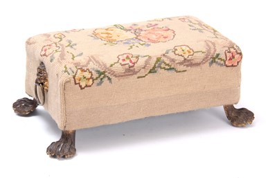 Lot 791 - A REGENCY UNHOLSTERED FOOTSTOOL having gilded...