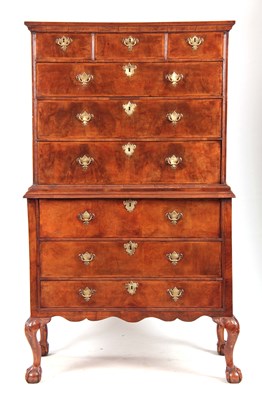 Lot 654 - A GEORGE I FIGURED WALNUT CHEST ON CHEST with...