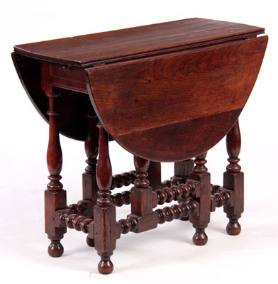 Lot 675 - A 17TH CENTURY SMALL OAK GATELEG TABLE with...