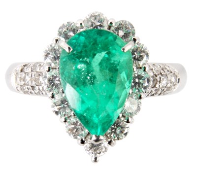 Lot 211 - A FINE PLATINUM PEAR SHAPED EMERALD AND...