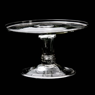 Lot 5 - A GEORGE III GLASS TAZZA the rimmed top on a...