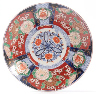 Lot 91 - A COLOURFUL LARGE IMARI CHARGER decorated in...