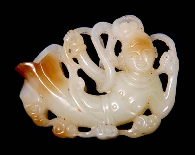 Lot 116 - A CHINESE PALE GREEN AND RUSSET CARVING...