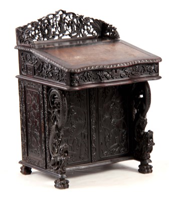 Lot 140 - A 19TH CENTURY CARVED HARDWOOD DAVENPORT with...