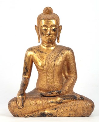 Lot 128 - A LARGE TIBETAN GILT METAL BUDDHA seated in a...