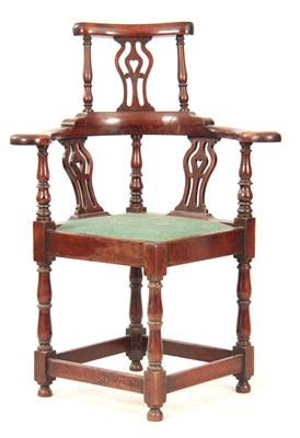 Lot 1031 - A GEORGE II WALNUT CORNER CHAIR with shaped...