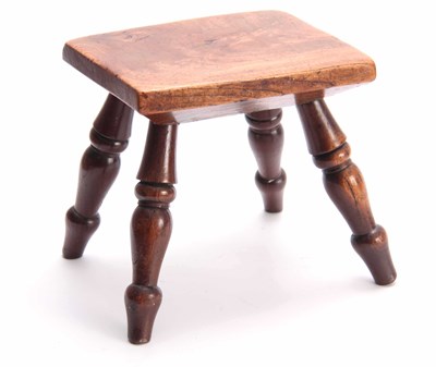 Lot 1067 - A 19TH CENTURY ELM STOOL with thick-cut...