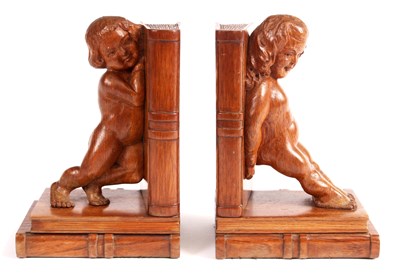 Lot 632 - A pair of figural carved Wood BOOKENDS 21cm high