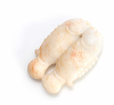 Lot 201 - A CHINESE CARVED WHITE RUSTED JADE PENDANT...