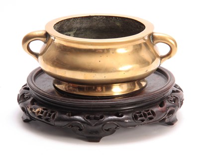 Lot 239 - AN EARLY CHINESE CAST BRASS CENSER of squat...