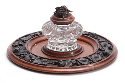 Lot 361 - A 19TH CENTURY CARVED OAK CIRCULAR INK STAND...