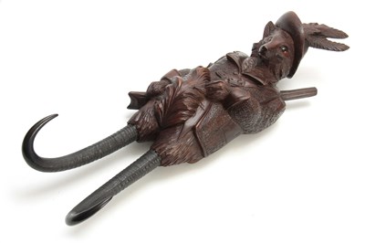 Lot 380 - A LARGE LATE 19th CENTURY MUSICAL CARVED BLACK...