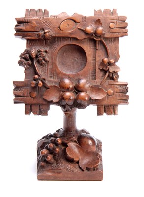 Lot 383 - A 19TH CENTURY SWISS CARVED BLACK FOREST...