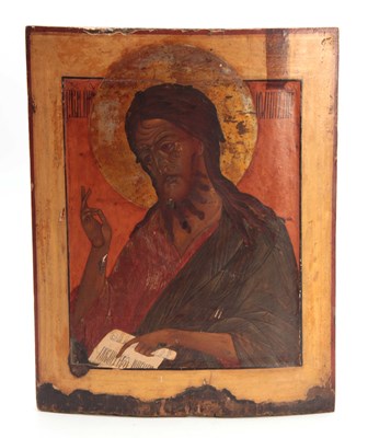 Lot 455 - AN EARLY RUSSIAN POLYCHROME PAINTED ICON OF A...