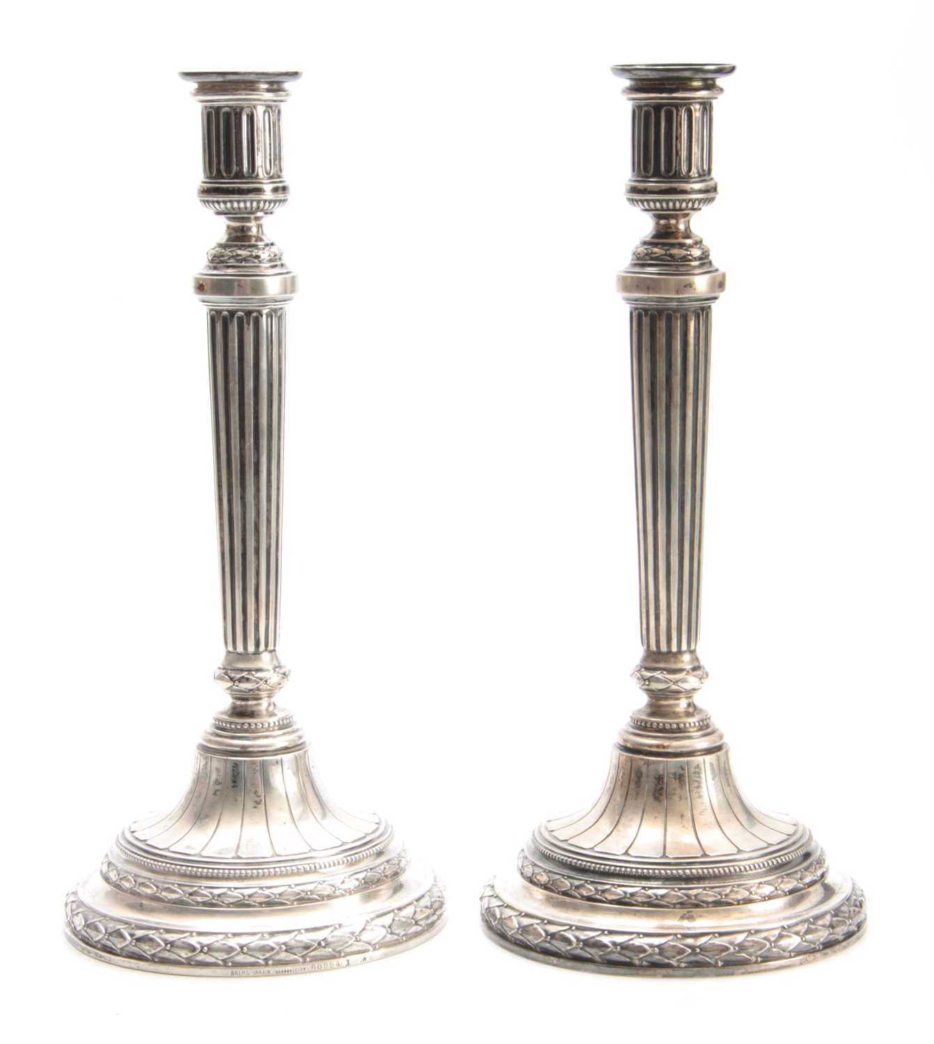 Lot 568 A PAIR OF GERMAN SILVER CANDLESTICKS having