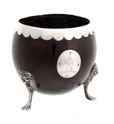 Lot 588 - A GEORGE III SILVER MOUNTED COCONUT SHELL CUP...