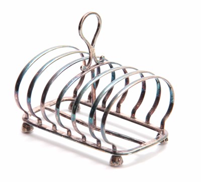 Lot 601 - A VICTORIAN SILVER TOAST RACK of six...