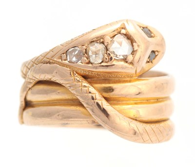 Lot 679 - A 15CT YELLOW GOLD COILED SNAKESHEAD RING set...