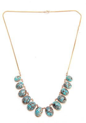 Lot 688 - A GOLD AND TURQUOISE NECKLACE having twelve...