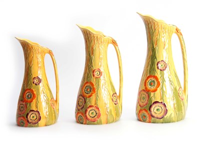 Lot 71 - A SET OF THREE CARLTON WARE TAPERING JUGS with...