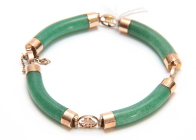 Lot 738 - AN ORIENTAL 14K YELLOW GOLD AND JADEITE...