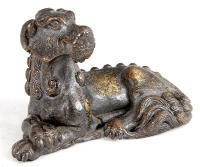 Lot 192 - AN EARLY CHINESE CAST BRONZE RECUMBENT DOG OF...
