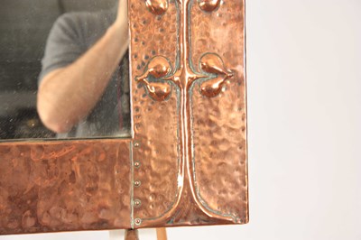 Lot 961 - AN ARET NOVEAU HAMMERED COPPER HANGING MIRROR...