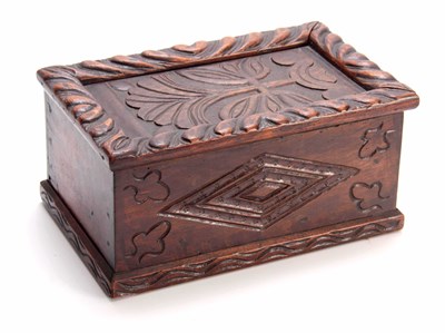 Lot 979 - A LATE 17TH CENTURY CARVED OAK CANDLE BOX with...