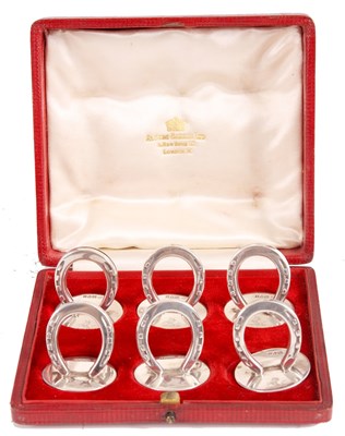 Lot 265 - A BOXED SET OF SIX SILVER MENU HODERS in the...