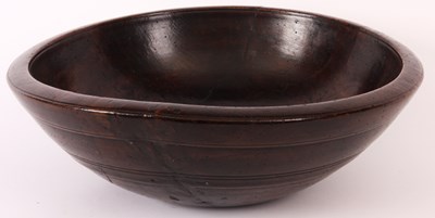 Lot 641 - A 19th Century large fruitwood BOWL with...