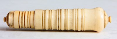 Lot 569 - A 19TH CENTURY TURNED IVORY TRAVELLING APPLE...