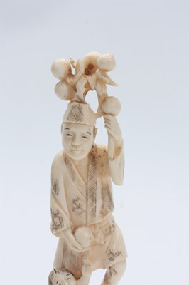 Lot 201 - A JAPANESE MEIJI PERIOD IVORY OKIMONO modelled...