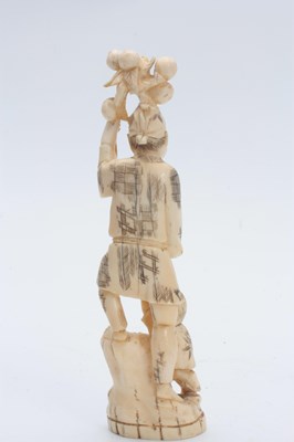 Lot 201 - A JAPANESE MEIJI PERIOD IVORY OKIMONO modelled...