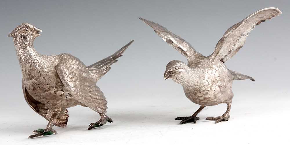 Lot 306 - A PAIR OF SILVER PHEASANTS modelled as a cock...