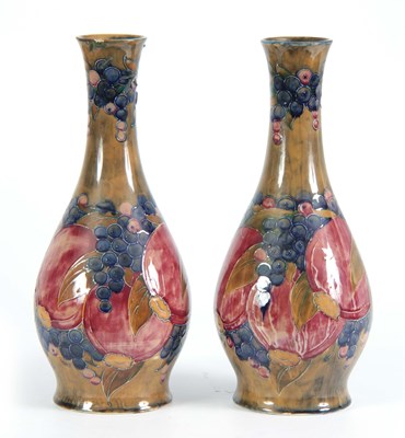 Lot 44 - A PAIR OF 20TH CENTURY MOORCROFT VASES...
