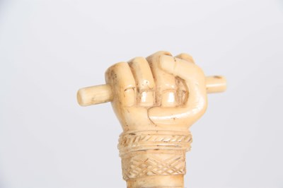 Lot 460 - A 19th CENTURY SCRIMSHAW WHALE BONE WALKING...