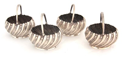 Lot 211 - A SET OF FOUR VICTORIAN SILVER CRUET BASKETS...