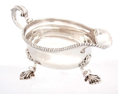 Lot 239 - A GEORGE III SCOTTISH SILVER SAUCE BOAT having...