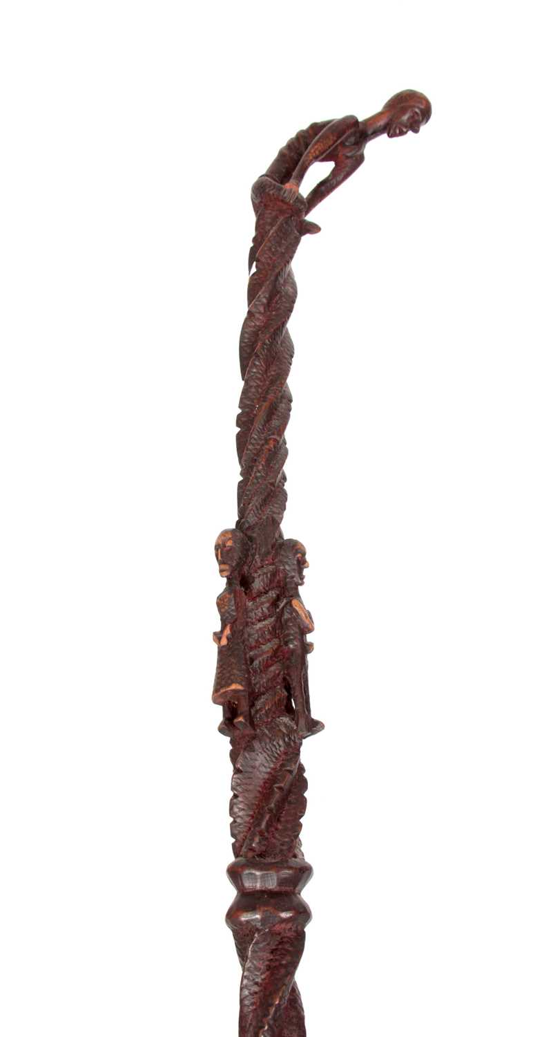 Lot 263 - AN AFRICAN TRIBAL WALKING STICK with twisted...