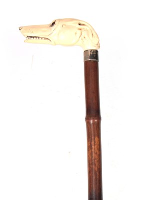 Lot 270 - A 19TH CENTURY IVORY CARVED DOGS HEAD HANDLE...