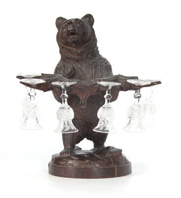 Lot 470 - A 19TH CENTURY BLACK FORREST CARVING OF A BEAR...