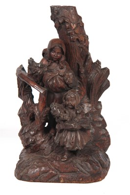 Lot 616 - A 19TH CENTURY BLACK FORREST CARVED FIGURE...