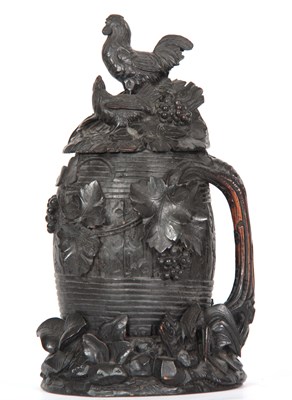 Lot 617 - A LARGE 19TH CENTURY SWISS CARVED WOOD STEIN...