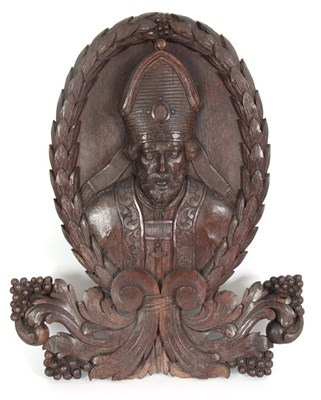 Lot 626 - A 19TH CENTURY CARVED OAK WALL PLAQUE modelled...