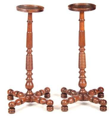 Lot 699 - A PAIR OF EARLY 19TH CENTURY WALNUT TORCHERES...