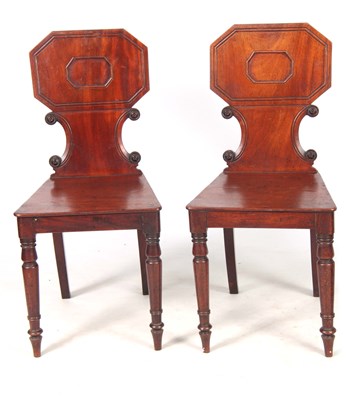 Lot 720 - A PAIR OF REGENCY MAHOGANY HALL CHAIRS with...