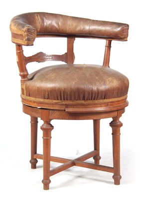 Lot 758 - A 19TH CENTURY OAK REVOLVING DESK CHAIR with...